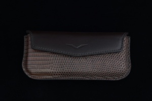 Horizontal case made of brown calf leather with embossed lizard skin.